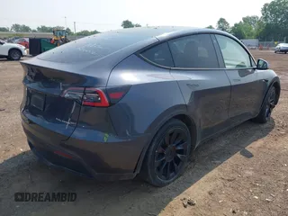 2021 Tesla Model Y Long Range z VIN 5YJYGDEE7MF140144, wystawiony jako IAAI lot #42350137 z przebiegiem Nie podano mil oraz . Historia ofert i sprzedaży dostępna na DreamBid. Obrazek 4.