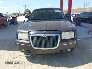 2009 Chrysler 300 Touring with VIN 2C3KA53V59H621936, listed as a IAAI auction lot 42112314 with 198,461 mi miles. Bid and sale history available at carsss.com. Image 6.
