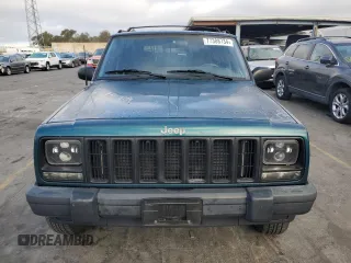 1998 Jeep Cherokee Sport with VIN 1J4FT68S2WL236774, listed as a Copart auction lot 77388734 with 128,591 mi miles and Clean Title. Bid and sale history available at carsss.com. Image 5.