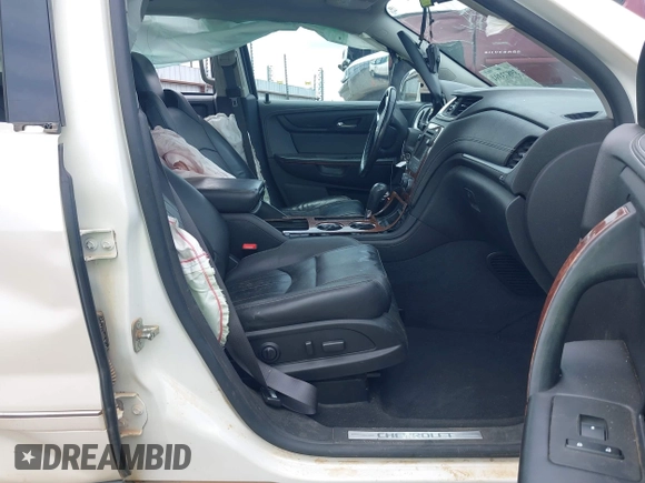 2014 Chevrolet Traverse LTZ with VIN 1GNKRJKD2EJ287211, listed as a IAAI auction lot 39873394 with 128,355 mi miles and . Bid and sale history available at DreamBid. Image 5.