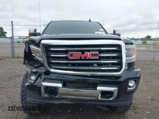 2015 GMC Sierra 2500HD SLT with VIN 1GT12ZE87FF552599, listed as a IAAI auction lot 40054977 with 146,190 mi miles and . Bid and sale history available at DreamBid. Image 6.
