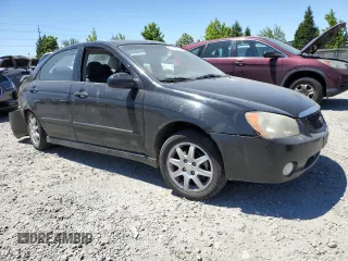 2005 Kia Spectra LX with VIN KNAFE121255156796, listed as a Copart auction lot 58595684 with 197,792 mi miles and Salvage Title. Bid and sale history available at carsss.com. Image 4.