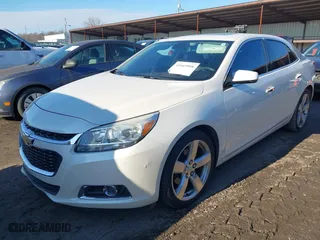 2014 Chevrolet Malibu LTZ with VIN 1G11J5SX0EF289841, listed as a IAAI auction lot 41669908 with 233,599 mi miles. Bid and sale history available at carsss.com. Image 2.