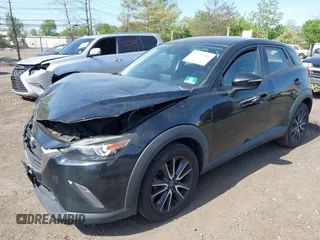 2018 Mazda CX-3 Touring z VIN JM1DKDC70J0329410, wystawiony jako IAAI lot #42137391 z przebiegiem 86 013 mil mil oraz . Historia ofert i sprzedaży dostępna na DreamBid. Obrazek 2.
