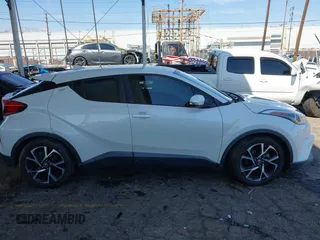 2018 Toyota C-HR XLE with VIN NMTKHMBX9JR022921, listed as a IAAI auction lot 41858651 with 50,448 mi miles. Bid and sale history available at carsss.com. Image 12.