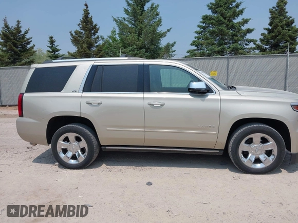 2015 Chevrolet Tahoe LTZ z VIN 1GNSKCKC0FR113647, wystawiony jako IAAI lot #42288089 z przebiegiem 113 322 mil mil oraz . Historia ofert i sprzedaży dostępna na DreamBid. Obrazek 13.