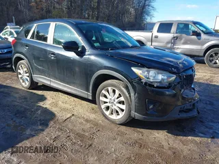 2014 Mazda CX-5 Grand Touring with VIN JM3KE4DY1E0303658, listed as a IAAI auction lot 41536769 with 158,777 mi miles. Bid and sale history available at carsss.com. Image 1.