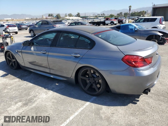 2015 BMW M6 z VIN WBS6C9C56FD467608, wystawiony jako Copart lot #67796074 z przebiegiem 67 706 mil mil oraz Szkoda całkowita • Salvage title. Historia ofert i sprzedaży dostępna na DreamBid. Obrazek 2.