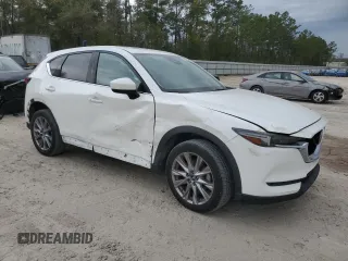 2021 Mazda CX-5 Grand Touring Reserve with VIN JM3KFBAY5M0320404, listed as a Copart auction lot 50405075 with 32,596 mi miles and Salvage Title. Bid and sale history available at carsss.com. Image 4.