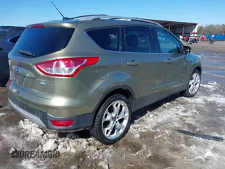 2013 Ford Escape Titanium with VIN 1FMCU9J99DUD46870, listed as a IAAI auction lot 41614409 with 141,739 mi miles and . Bid and sale history available at DreamBid. Image 4.