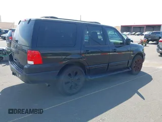 2003 Ford Expedition XLT Value with VIN 1FMPU16W73LC19198, listed as a IAAI auction lot 41570000 with 111,893 mi miles. Bid and sale history available at carsss.com. Image 4.