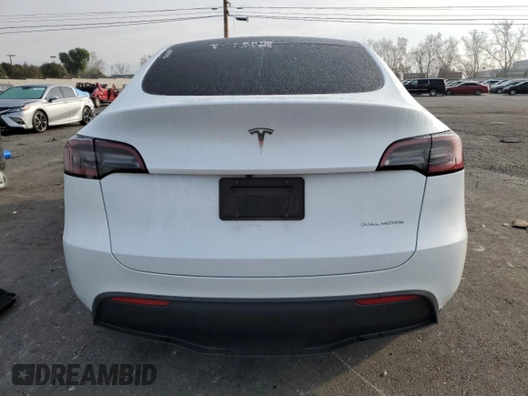 2023 Tesla Model Y Long Range with VIN 7SAYGDEE5PA125887, listed as a Copart auction lot 43188655 with 31,472 mi miles and Salvage Title. Bid and sale history available at DreamBid. Image 6.