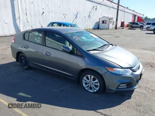 2012 Honda Insight EX z VIN JHMZE2H75CS004736, wystawiony jako IAAI lot #39389829 z przebiegiem 118 401 mil mil oraz . Historia ofert i sprzedaży dostępna na DreamBid. Obrazek 1.
