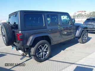 2024 Jeep Wrangler Sport S with VIN 1C4RJXN61RW192386, listed as a IAAI auction lot 42001810 with 7,426 mi miles and . Bid and sale history available at DreamBid. Image 4.