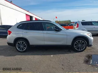 2014 BMW X1 sDrive28i with VIN WBAVM1C58EVW52847, listed as a IAAI auction lot 40779553 with 151,076 mi miles. Bid and sale history available at carsss.com. Image 13.
