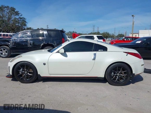 2004 Nissan 350Z Touring with VIN JN1AZ34E74T064156, listed as a IAAI auction lot 41498213 with 148,370 mi miles. Bid and sale history available at carsss.com. Image 14.