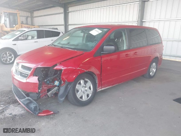 2012 Dodge Grand Caravan SE with VIN 2C4RDGBG0CR157374, listed as a IAAI auction lot 40502846 with 112,079 mi miles. Bid and sale history available at carsss.com. Image 2.