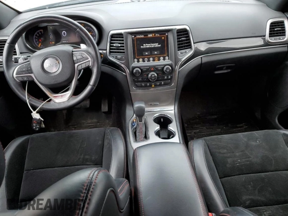 2018 Jeep Grand Cherokee Trailhawk with VIN 1C4RJFLG8JC164774, listed as a Copart auction lot 51699845 with 104,467 mi miles and Salvage title. Bid and sale history available at DreamBid. Image 8.