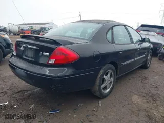 2003 Ford Taurus SEL Deluxe with VIN 1FAHP56S83A243290, listed as a IAAI auction lot 41743609 with 206,399 mi miles. Bid and sale history available at carsss.com. Image 4.