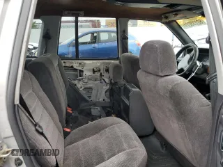 1997 Jeep Grand Cherokee Laredo with VIN 1J4GZ58S0VC771727, listed as a Copart auction lot 82233224 with 320,213 mi miles and Salvage Title. Bid and sale history available at carsss.com. Image 10.