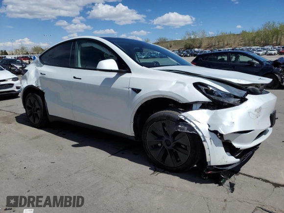 2024 Tesla Model Y Long Range with VIN 7SAYGAEE7RF205700, listed as a Copart auction lot 53814155 with 8,986 mi miles and Salvage Title. Bid and sale history available at DreamBid. Image 4.