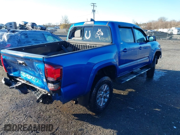 2018 Toyota Tacoma SR with VIN 3TMCZ5AN3JM138480, listed as a IAAI auction lot 41080910 with 99,225 mi miles. Bid and sale history available at carsss.com. Image 4.
