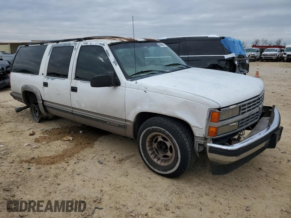 1999 Chevrolet Suburban with VIN 1GNEC16R7XJ418169, listed as a Copart auction lot 88995495 with 2,015,240 mi miles and Salvage title. Bid and sale history available at DreamBid. Image 4.