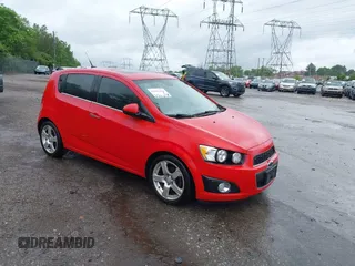 2012 Chevrolet Sonic LTZ z VIN 1G1JE6SH7C4145473, wystawiony jako IAAI lot #42267403 z przebiegiem 163 830 mil mil oraz . Historia ofert i sprzedaży dostępna na DreamBid. Obrazek 1.