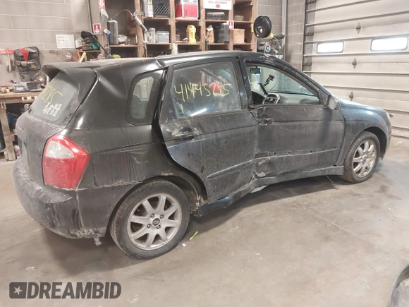 2005 Kia Spectra with VIN KNAFE161255083357, listed as a IAAI auction lot 41445285 with 90,349 mi miles. Bid and sale history available at carsss.com. Image 4.