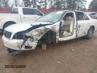 2002 Cadillac DeVille DHS z VIN 1G6KE57YX2U212020, wystawiony jako IAAI lot #41287342 z przebiegiem Nie podano mil oraz . Historia ofert i sprzedaży dostępna na DreamBid. Obrazek 17.