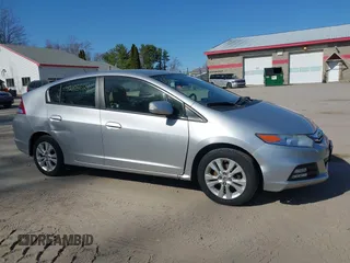 2013 Honda Insight EX z VIN JHMZE2H70DS005200, wystawiony jako IAAI lot #42105624 z przebiegiem 108 949 mil mil oraz . Historia ofert i sprzedaży dostępna na DreamBid. Obrazek 14.