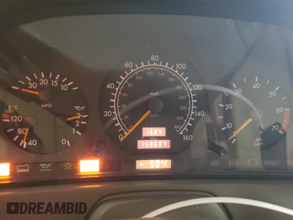 1997 Mercedes-Benz SL 500 with VIN WDBFA67F5VF147986, listed as a Copart auction lot 84255574 with 158,607 mi miles and Salvage title. Bid and sale history available at DreamBid. Image 9.