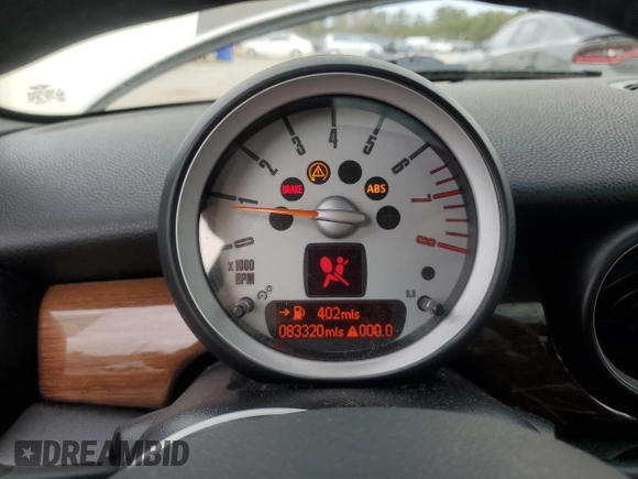2007 MINI Hardtop S with VIN WMWMF735X7TL83242, listed as a Copart auction lot 41609565 with 83,320 mi miles and Salvage Title. Bid and sale history available at DreamBid. Image 9.