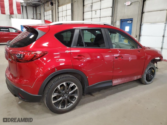 2016 Mazda CX-5 Grand Touring with VIN JM3KE4DY7G0701881, listed as a Copart auction lot 52872925 with 118,559 mi miles and Salvage Title. Bid and sale history available at carsss.com. Image 3.