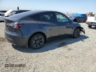 2025 Tesla Model Y Long Range z VIN 7SAYGDED0SF317270, wystawiony jako Copart lot #52387395 z przebiegiem 1 350 mil mil oraz Szkoda całkowita • Salvage title. Historia ofert i sprzedaży dostępna na DreamBid. Obrazek 3.