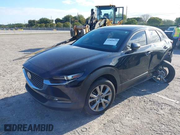 2023 Mazda CX-30 S Select with VIN 3MVDMBBM9PM508958, listed as a IAAI auction lot 42009029 with 21,219 mi miles and . Bid and sale history available at DreamBid. Image 2.