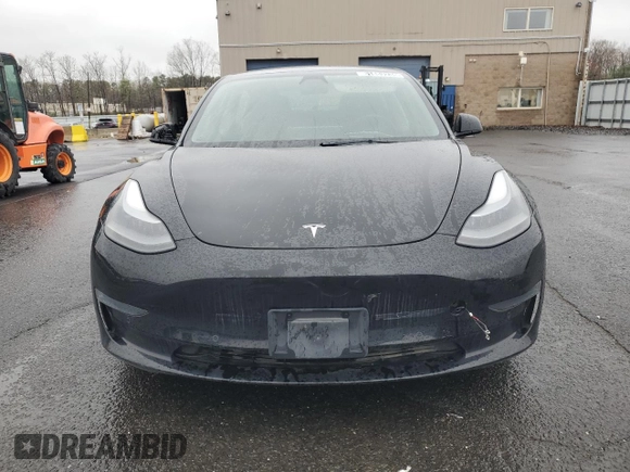 2021 Tesla Model 3 Standard Range Plus with VIN 5YJ3E1EA2MF087879, listed as a Copart auction lot 51853235 with 65,477 mi miles and Non Repairable. Bid and sale history available at carsss.com. Image 5.