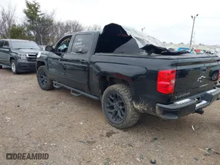 2016 Chevrolet Silverado 1500 LT with VIN 3GCUKREC6GG353660, listed as a IAAI auction lot 41240370 with 130,448 mi miles. Bid and sale history available at carsss.com. Image 3.