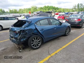 2018 Mazda 3 Touring z VIN 3MZBN1L38JM235604, wystawiony jako IAAI lot #42333995 z przebiegiem 69 541 mil mil oraz . Historia ofert i sprzedaży dostępna na DreamBid. Obrazek 4.