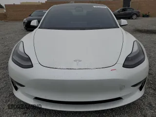 2021 Tesla Model 3 Standard Range Plus z VIN 5YJ3E1EAXMF065760, wystawiony jako Copart lot #54235345 z przebiegiem 54 413 mil mil oraz Szkoda całkowita • Salvage title. Historia ofert i sprzedaży dostępna na DreamBid. Obrazek 5.
