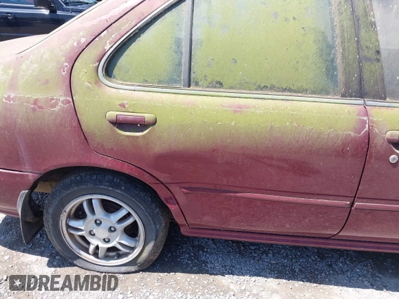 1999 Nissan Sentra XE with VIN 3N1AB41D0XL107458, listed as a IAAI auction lot 42536232 with 119,701 mi miles and . Bid and sale history available at DreamBid. Image 14.