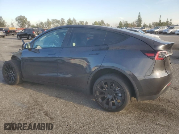 2024 Tesla Model Y with VIN 7SAYGDED7RF056973, listed as a Copart auction lot 87139214 with 15,391 mi miles and Salvage Title. Bid and sale history available at DreamBid. Image 2.
