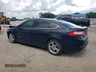 2016 Ford Fusion Titanium Hybrid with VIN 3FA6P0RUXGR204106, listed as a Copart auction lot 62769015 with 106,826 mi miles and Salvage title. Bid and sale history available at DreamBid. Image 2.