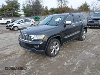 2013 Jeep Grand Cherokee Overland with VIN 1C4RJECG5DC621149, listed as a IAAI auction lot 41255140 with 157,355 mi miles. Bid and sale history available at carsss.com. Image 17.