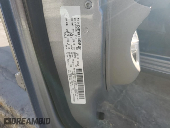 2014 Dodge Grand Caravan SXT with VIN 2C4RDGCG1ER121033, listed as a Copart auction lot 52030715 with 105,451 mi miles and Salvage Title. Bid and sale history available at DreamBid. Image 13.