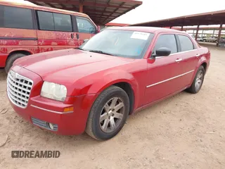 2010 Chrysler 300 Touring with VIN 2C3CA5CV3AH138812, listed as a IAAI auction lot 41870285 with 165,788 mi miles. Bid and sale history available at carsss.com. Image 2.