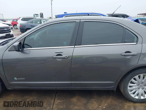 2012 Ford Fusion Hybrid z VIN 3FADP0L33CR289548, wystawiony jako IAAI lot #41905806 z przebiegiem 121 233 mil mil oraz . Historia ofert i sprzedaży dostępna na DreamBid. Obrazek 15.