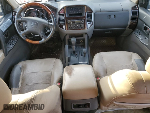 2002 Mitsubishi Montero Limited z VIN JA4MW51R12J020808, wystawiony jako Copart lot #41915255 z przebiegiem 127 834 mil mil oraz Czysty tytuł • Clean title. Historia ofert i sprzedaży dostępna na DreamBid. Obrazek 8.