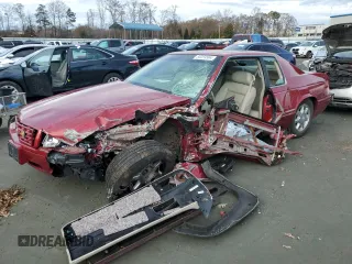 2001 Cadillac Eldorado Touring ETC z VIN 1G6ET12961B108467, wystawiony jako Copart lot #85259564 z przebiegiem 77 977 mil mil oraz Szkody całkowita. Historia ofert i sprzedaży dostępna na DreamBid. Obrazek 1.
