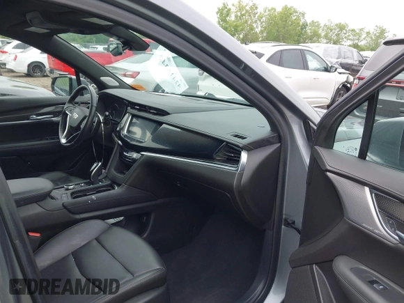 2021 Cadillac XT6 Sport with VIN 1GYKPGRS6MZ128112, listed as a IAAI auction lot 42415342 with 57,680 mi miles and . Bid and sale history available at DreamBid. Image 5.